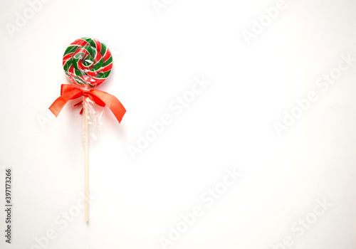 bright sweet christmas lollipop on white background