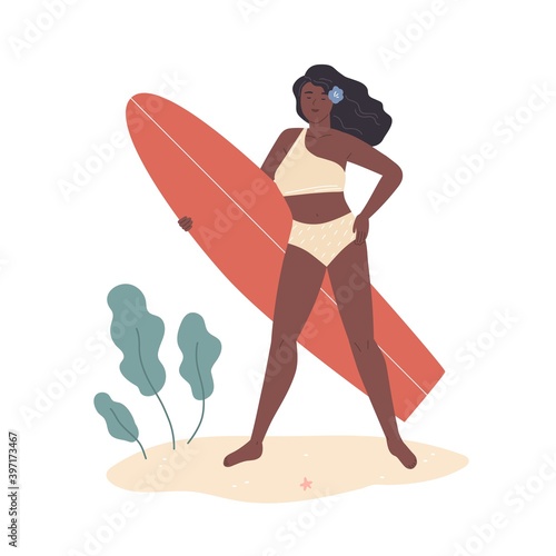 Beautiful african american woman in bikini stand on summer beach and hold sur...