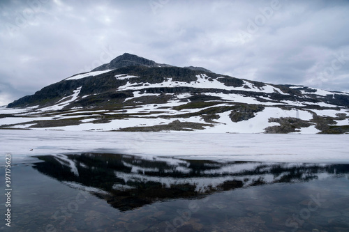 Mountain top reflecting in a lake