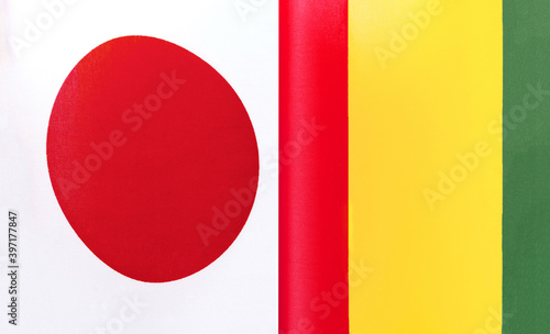 fragments of the national flags of Japan and the Republic of Guinea close-up