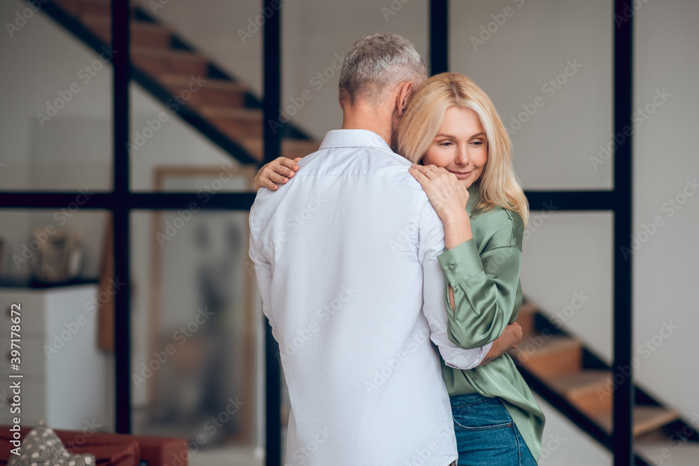 Man and woman hugging each other and feeling peaceful Man and woman hugging each other and feeling peaceful