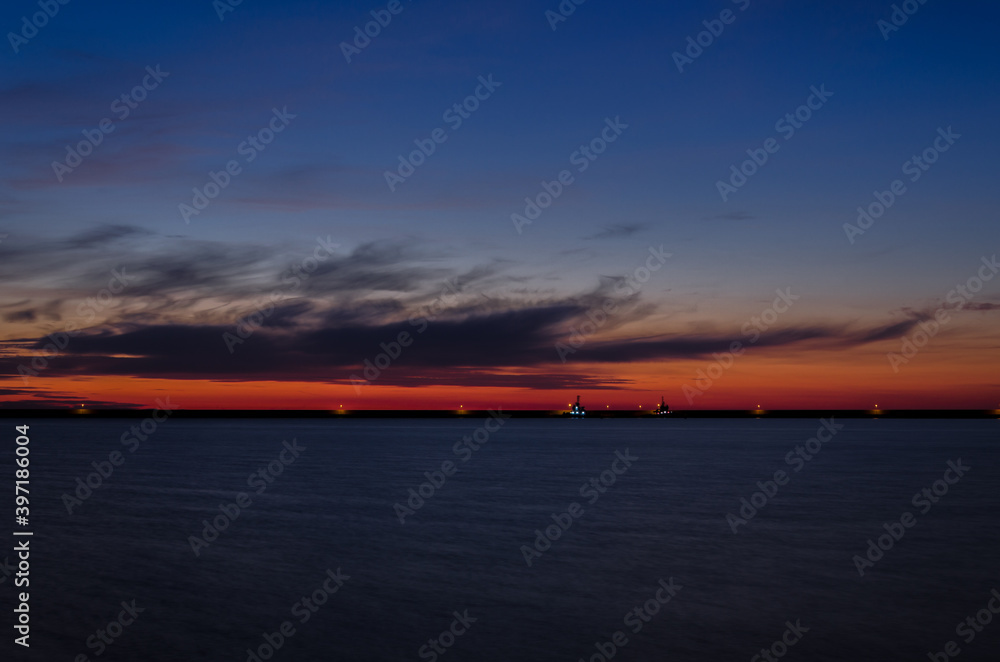 FIREABOAT AND TUG - Sunrise over the LNG terminal 
