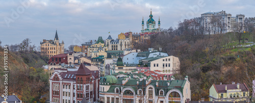 View of St. Andrew's Church, Richard Castle, Andriivskyi Descent and in the foreground the old Vozdvyzhens'ka street, Kyiv, Ukraine photo