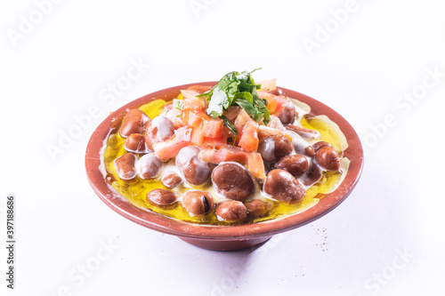 foul or ful Modammas Fava Beans Traditional Dish of Beans for all arab - White background 
