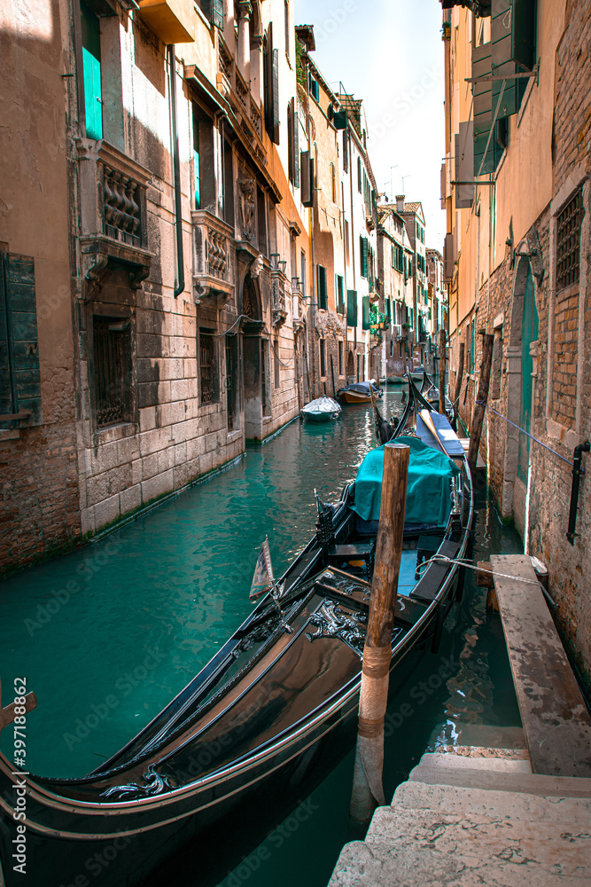 Sunny Venice, Italy. Old colorful buildings, narrow streets and bridges. Monuments of Venice
