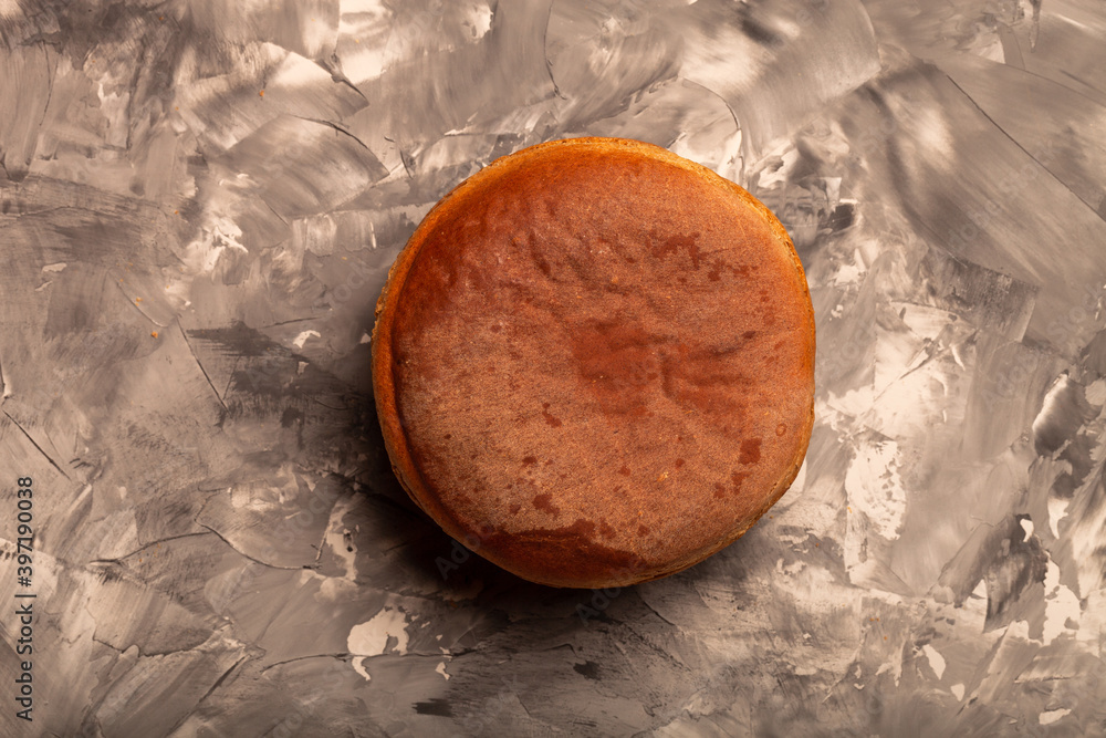 Composition with a bread on a textured plastered surface Composition with a bread on a textured plastered surface