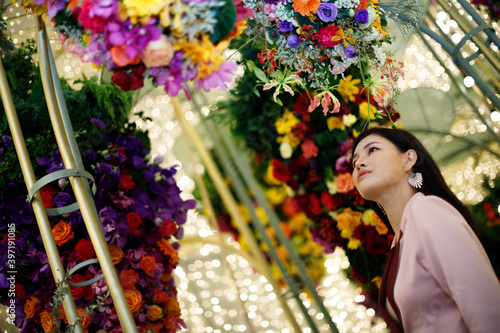 Business Woman feel happy in flowers garden field