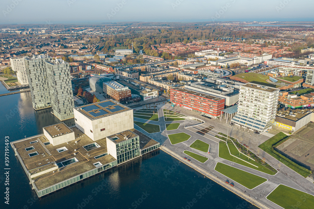 Modern architecture of Almere (Netherlands, suburb of Amsterdam) city center with newly renovated Esplanade square near lake (weerwater). Aerial view. 