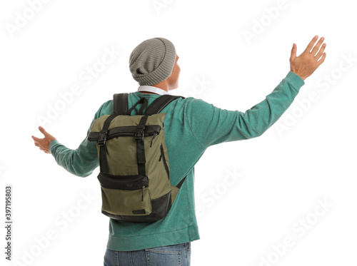 Man with backpack on white background, back view. Autumn travel
