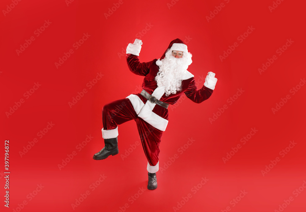 Full length portrait of Santa Claus on red background Full length portrait of Santa Claus on red background