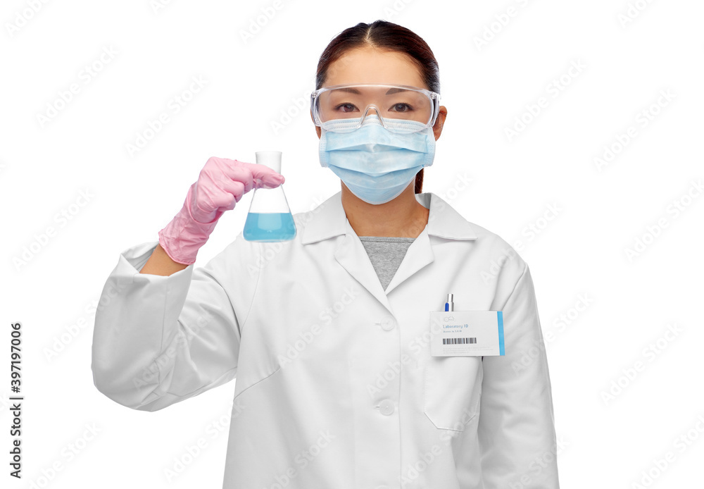 science, chemistry and people concept - young asian female scientist in mask and goggles with chemical in flask making test or research science, chemistry and people concept - young asian female scientist in mask and goggles with chemical in flask making test or research