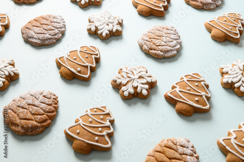 Christmas homemade gingerbread cookies on blue background. Xmas greeting card. Isometric. Close up.