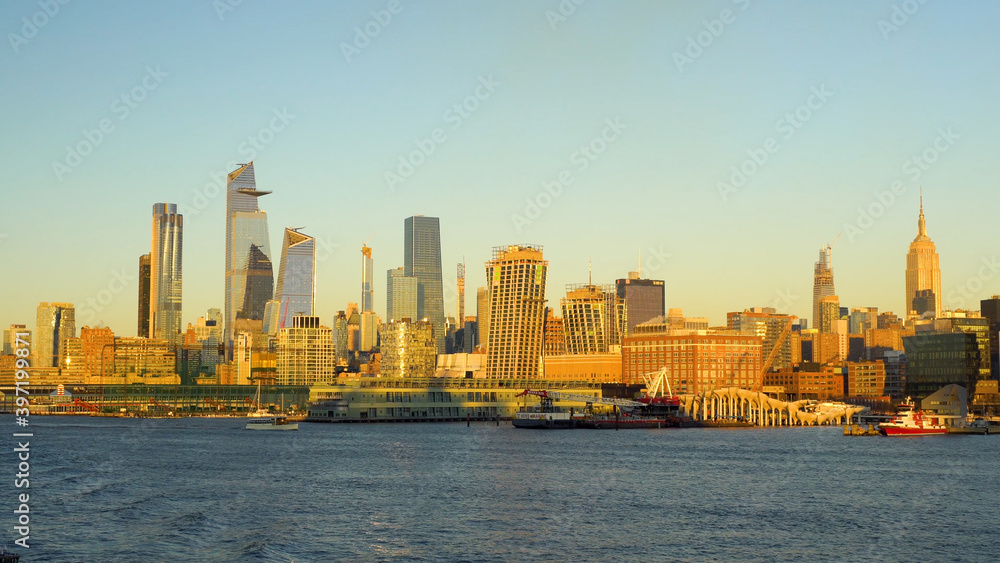 Manhattan Cruise Terminal during the beautiful golden sunset. Famous skyline of New York City.