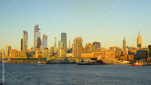 Manhattan Cruise Terminal during the beautiful golden sunset. Famous skyline of New York City.