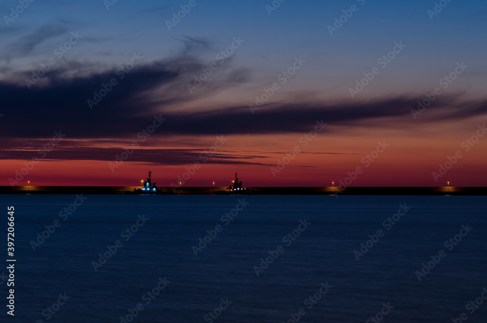 FIREABOAT AND TUG - Sunrise over the LNG terminal 