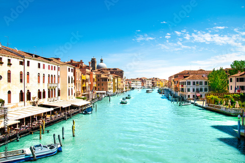 Summer in Venice, Italy. Grand canal. View of old buildings, narrow streets and bridges. Monuments of one of the most beautiful cities in Italy.