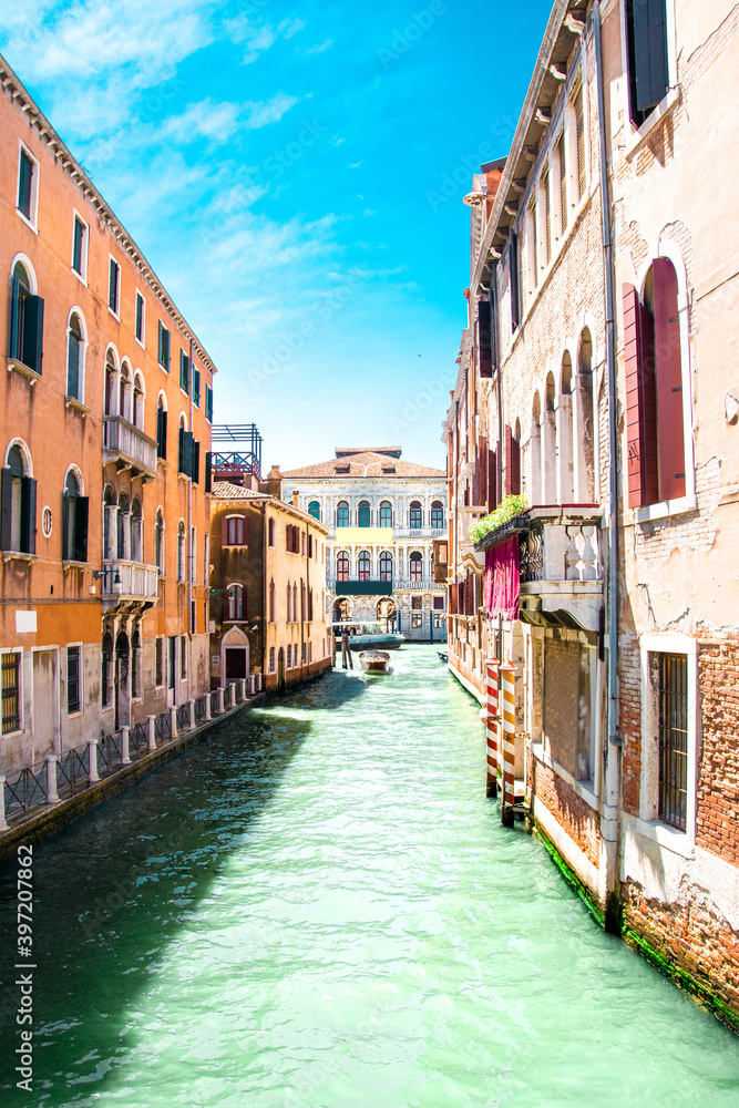 Sunny Venice, Italy. Old colorful buildings, narrow streets and bridges. Monuments of Venice