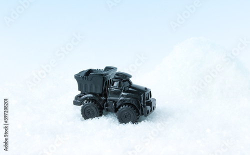 Toy car makes snow removal.