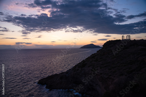 Greece Cape Sounio. Ruins of an ancient temple of Poseidon, Greek god of the sea, shot before sunset with sea view. Tourist landmark of Attica, Sounion, Greece