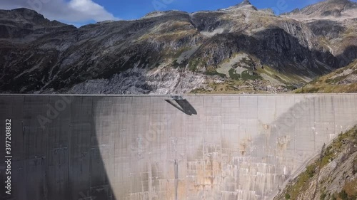 Flight over of Kolnbrein Dam and Kolnbreinspeicher lake in Carinthia, Austria. photo