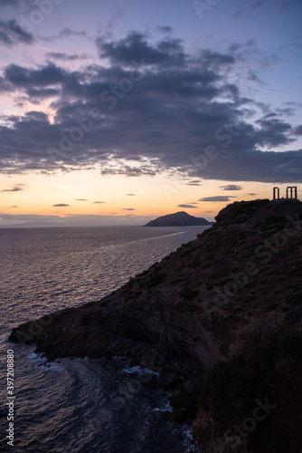 Greece Cape Sounio. Ruins of an ancient temple of Poseidon, Greek god of the sea, shot before sunset with sea view. Tourist landmark of Attica, Sounion, Greece