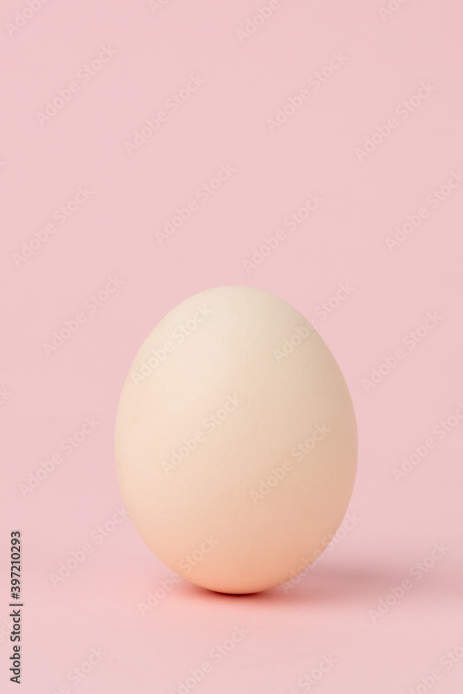 Boiled egg on pink background