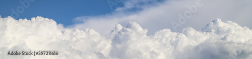 Fotografie White thick clouds and blue sky banner. Sunny day background