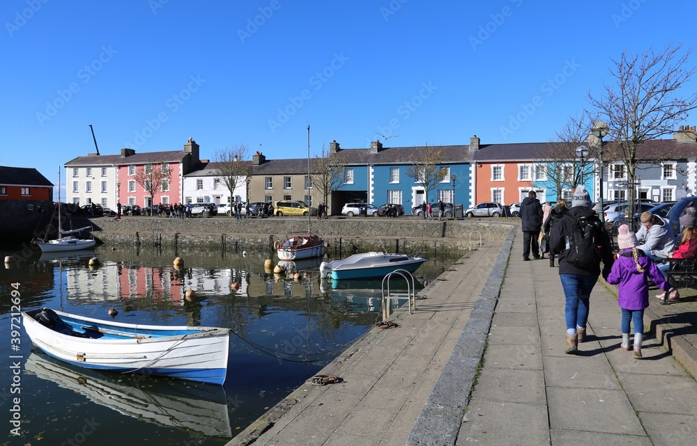 Colourful houses and buildings beside the pretty harbour at   Aberaeron, Ceredigion, Wales, UK.