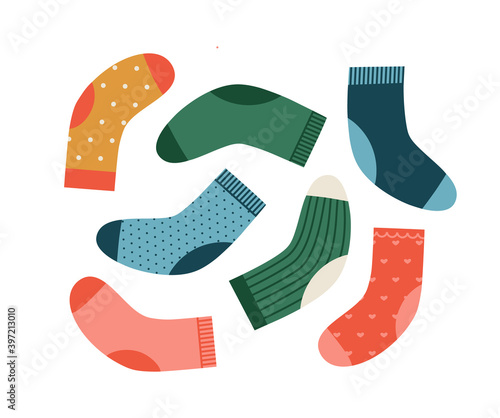 Vector illustration of the socks in different colors and print. Hand-drawn set isolated on white background. Winter holidays concept. Christmas Stockings.