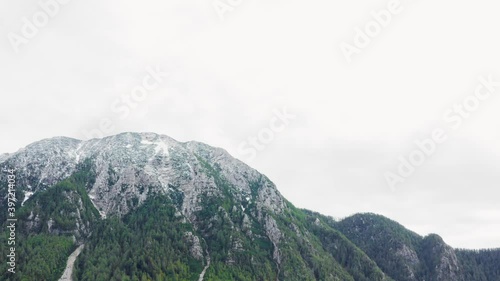 White peaks and forest, Hochobir mountain, Zell, Austria. Panning shot photo