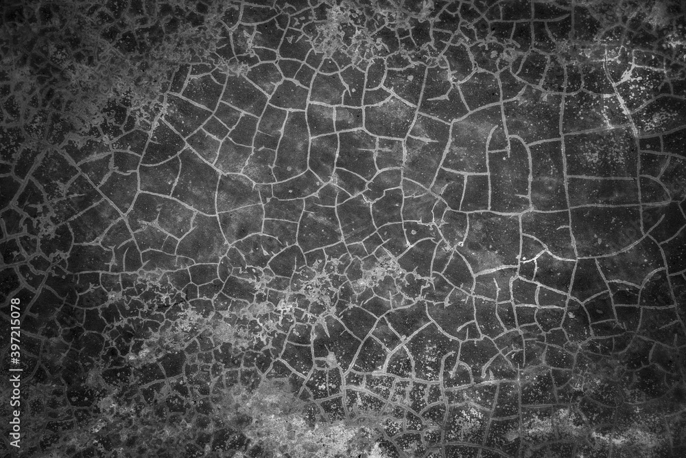 Cracked cement wall background. Grey cracked weathered concrete wall texture.