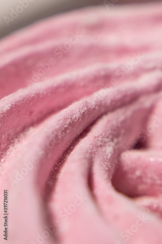Abstract macro lines meringue. Colored sweet pink dessert zephyr or marshmallows in pastel colors. close-up, selective focus.