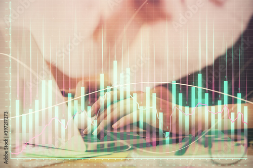 Multi exposure of woman hands typing on computer and financial graph hologram drawing. Stock market analysis concept. © peshkova