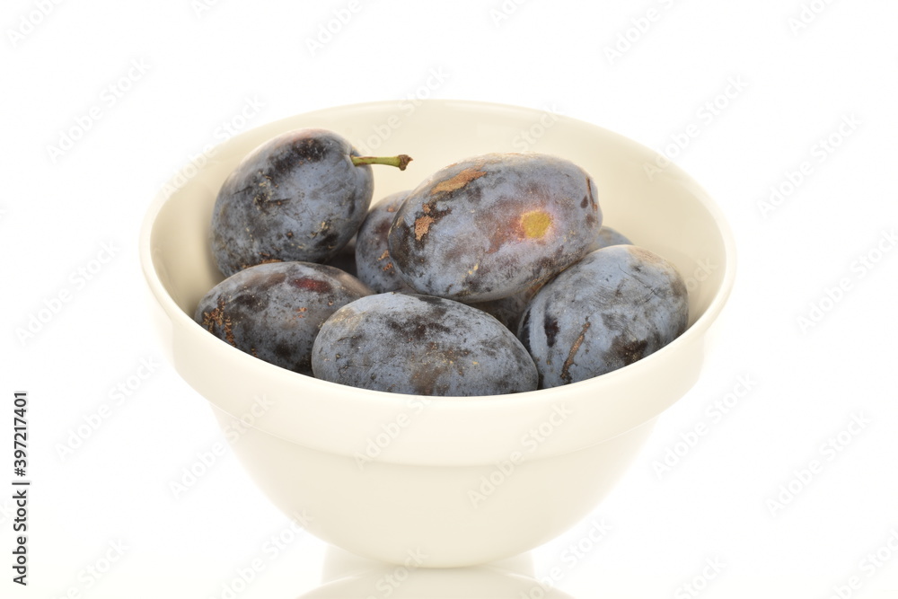 Several ripe organic Damson plums, close-up, isolated on white. Several ripe organic Damson plums, close-up, isolated on white.