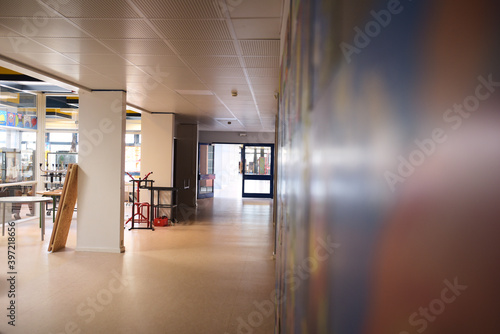 empty school hallway with art on wall