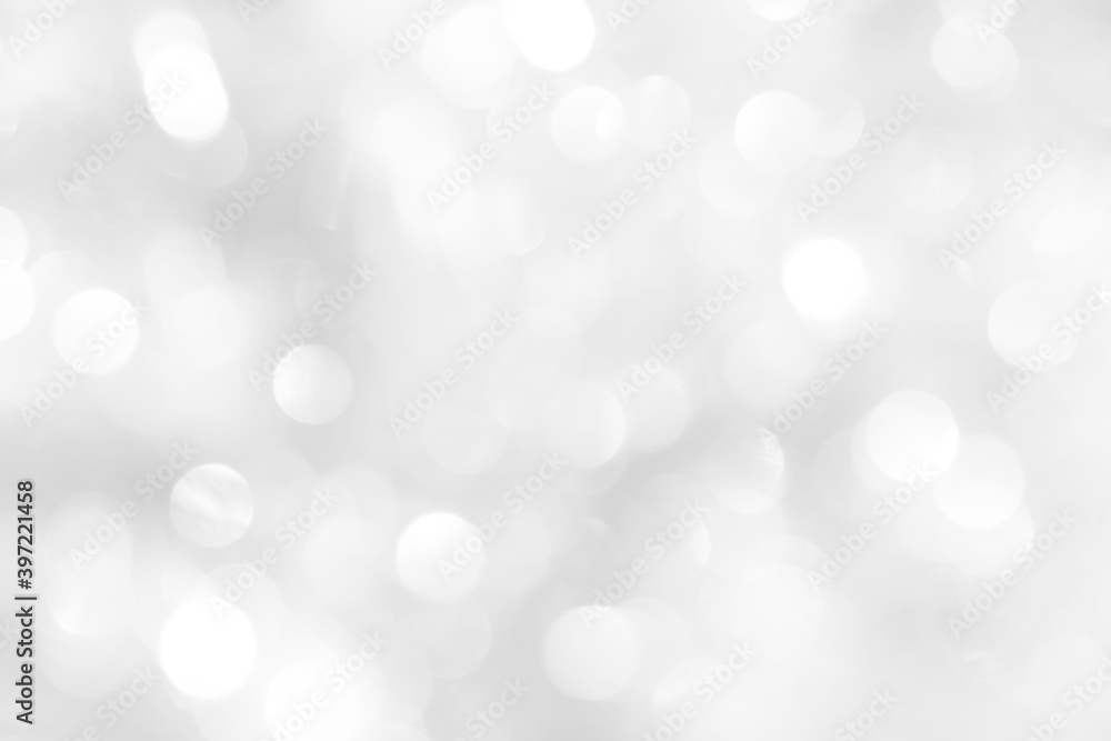 White sparkles with blurry circles texture, soft bokeh for a beautiful new year screensaver. Template for decoration of a holiday postcard, web design.