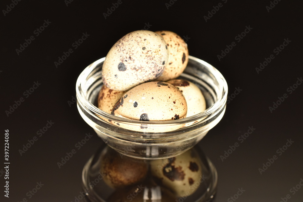 Fresh quail eggs, close-up, isolated on black. Fresh quail eggs, close-up, isolated on black.