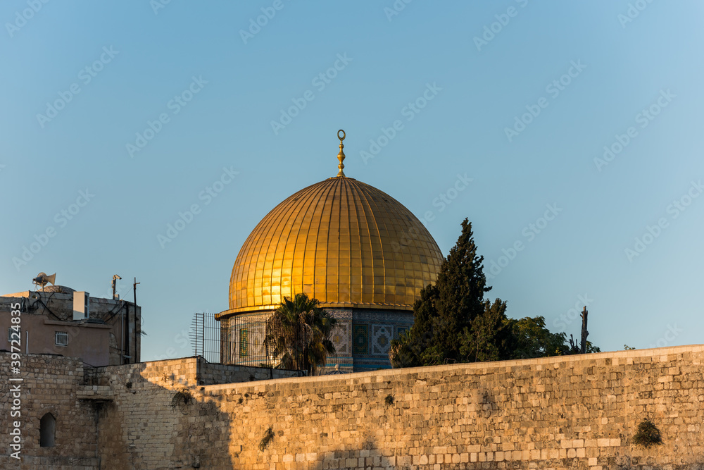 Close-up of Golden Dome of the Rock, Qubbat al-Sakhrah, under sunset on Temple Mount of Old City of Jerusalem,  Israel. One of the oldest extant works of Islamic architecture