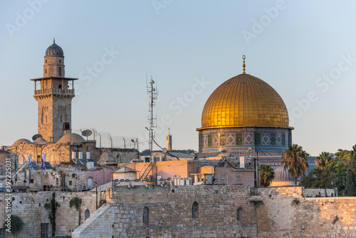 The Dome of the Rock, or called Qubbat al-Sakhra,  and Bab al Silsila Minaret under sunset,  an Islamic shrine located on the Temple Mount in the Old City of Jerusalem.