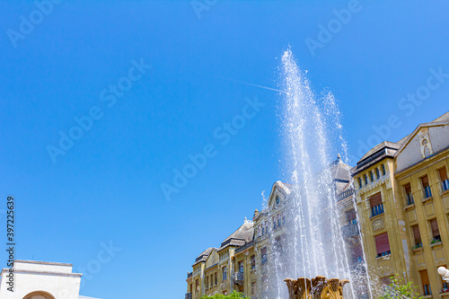 Tablou pe pânză Jet of water from fountain splashes high