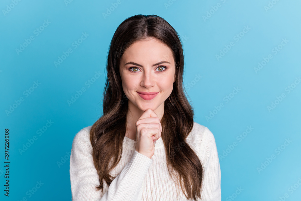 Photo of cheerful charming wavy lady wear white sweater arm chin isolated blue color background Photo of cheerful charming wavy lady wear white sweater arm chin isolated blue color background