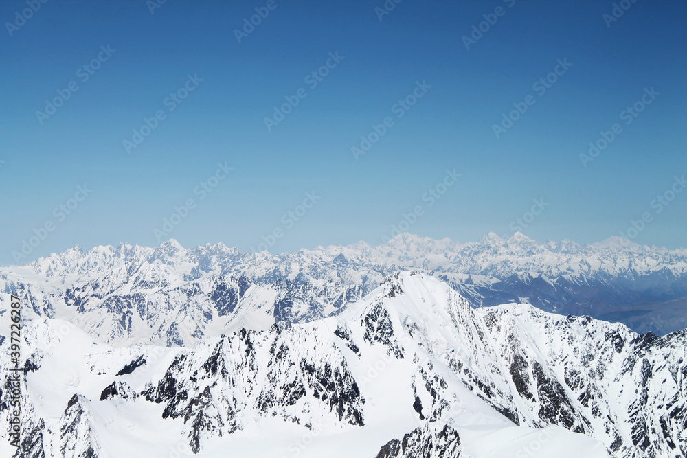 snow covered mountains from the top of Kazbegi