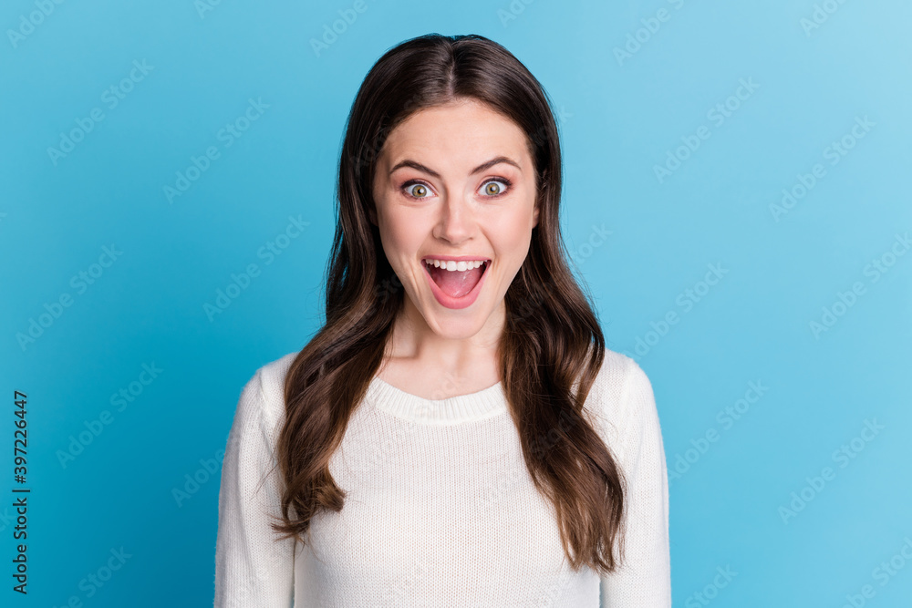 Photo of sweet impressed wavy lady wear white sweater open mouth isolated blue color background Photo of sweet impressed wavy lady wear white sweater open mouth isolated blue color background