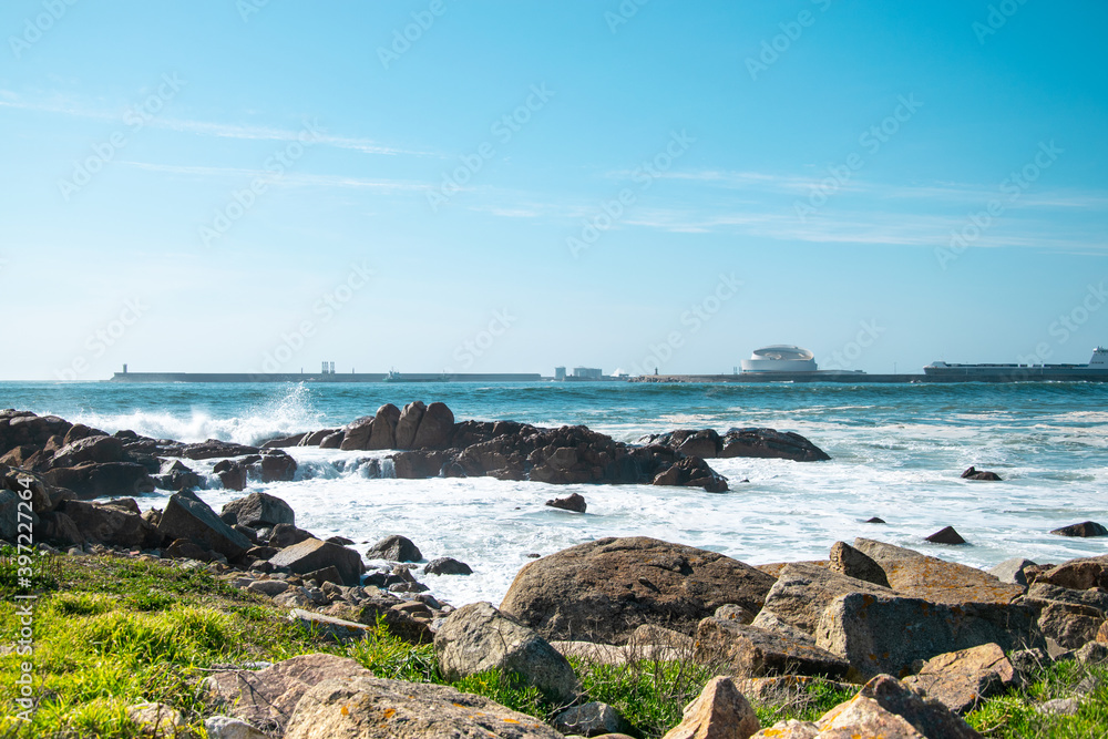 Matosinhos beach in Porto, Portugal. Cruise terminal, rocks and beach by the Atlantic Ocean. Big waves on the ocean
