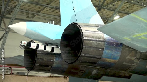 Checking the performance of a special hook with which the plane clings to brake cables during landing. Close-up. Maintenance of Su-33 fighter (NATO codification: Flanker-D). 
