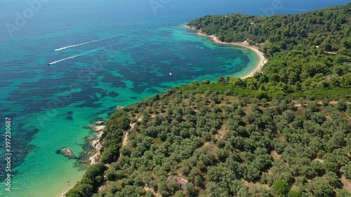 Aerial drone video of beautiful sandy beach of Agia Eleni next to famous banana beach, Skiathos island, Sporades, Greece photo