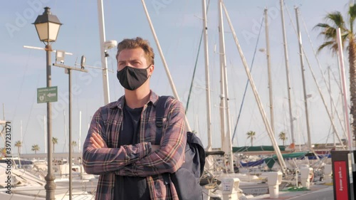 Transport Engineer Man Wearing Medical Face Mask for Prevention Coronavirus Epidemic Situation in Port Logistic Shipping Yard. Transportation and Logistics after Coronavirus Covid-19