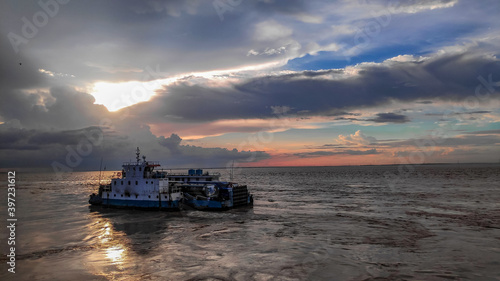 ship in sea during sunset