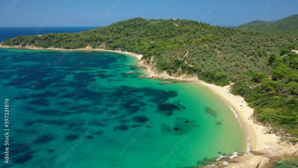 Aerial drone video of paradise beach of Banana covered with pine trees in beautiful island of Skiathos, Sporades, Greece Aerial drone video of paradise beach of Banana covered with pine trees in beautiful island of Skiathos, Sporades, Greece