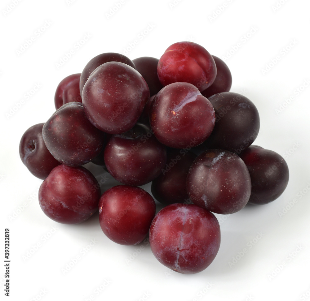 Slide of organic plums on white background Slide of organic plums on white background